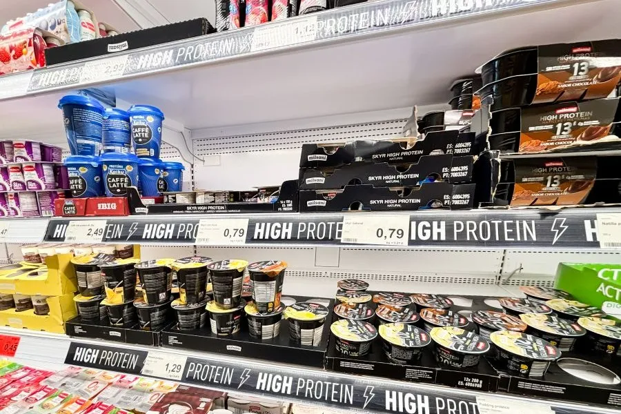 Fortified and high-protein foods in a supermarket aisle.